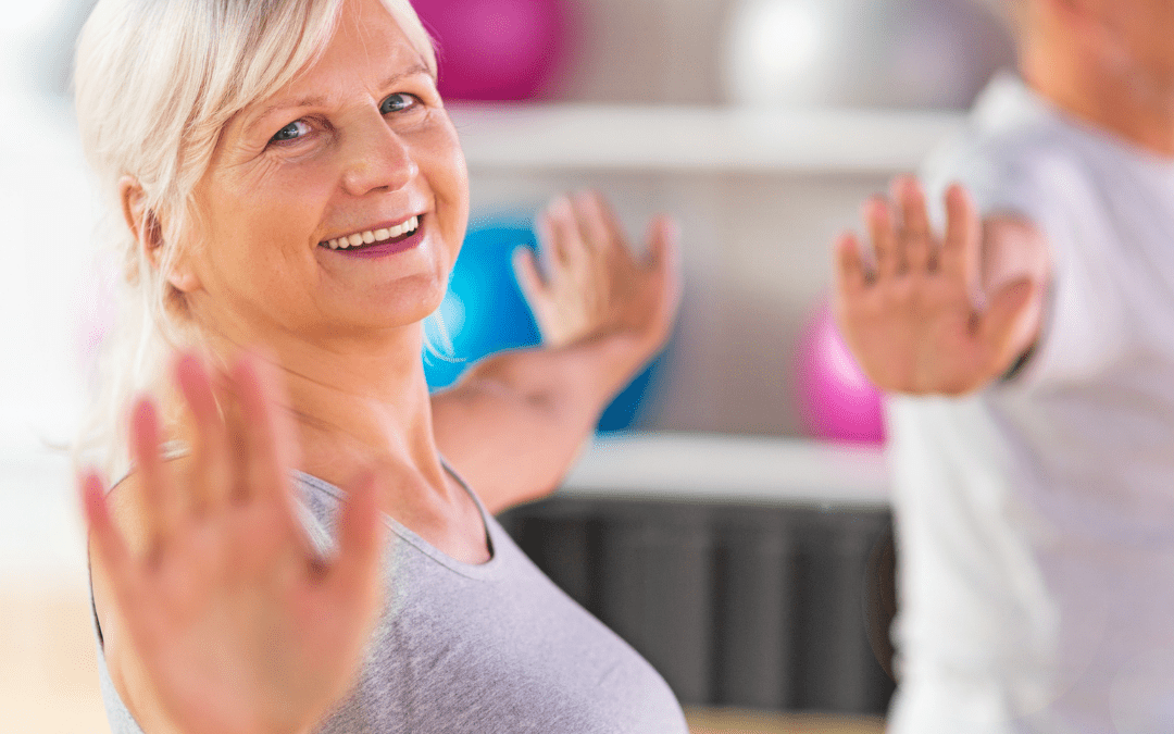 Lady in exercise class looking at camera and smiling